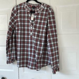 Festive plaid blouse.